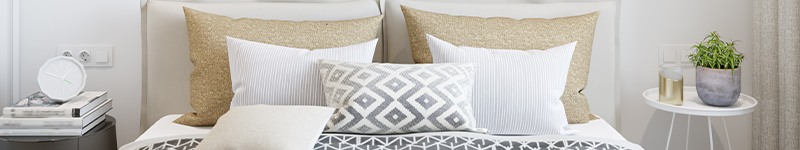 bed with pillows and nightstands