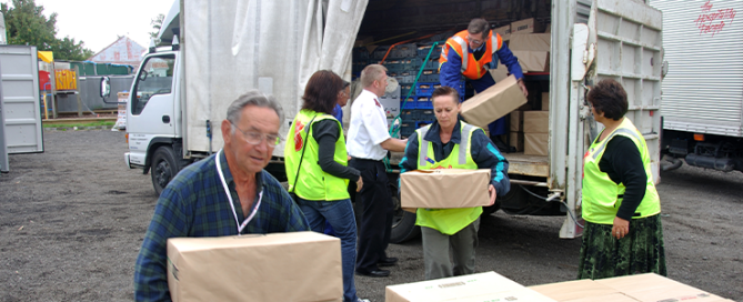 Volunteers unload food for victims of the 6.4 earthquake in Christchurch, South Island, New Zealand