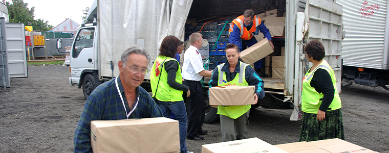 Volunteers unload food for victims of the 6.4 earthquake in Christchurch, South Island, New Zealand