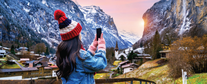 Tourist visiting village of Lauterbrunnen in the Bernese Oberland, Switzerland.