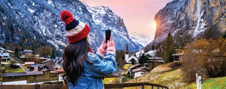 Tourist visiting village of Lauterbrunnen in the Bernese Oberland, Switzerland.