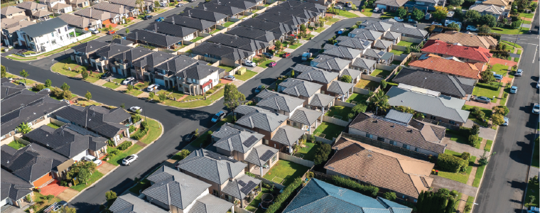 Aerial view of rows of detached houses built during the 2010s in outer suburban Sydney, Australia