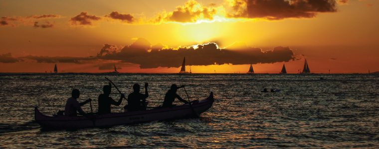 Hawaiian Paddlers Riding into the Tropical Sunset